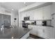 Kitchen with white cabinets, stainless steel appliances, gray countertops, and a large island at 1100 Howell Mill Nw Rd # 708, Atlanta, GA 30318