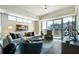 Bright living room with large windows and a sliding glass door to a balcony at 1100 Howell Mill Nw Rd # 708, Atlanta, GA 30318