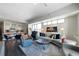 Open-concept living and kitchen area filled with natural light, featuring modern furnishings and decor at 1100 Howell Mill Nw Rd # 708, Atlanta, GA 30318