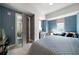 Inviting bedroom with blue walls, a ceiling fan, a cozy seating area, and ample space; perfect for relaxation at 1100 Howell Mill Nw Rd # 708, Atlanta, GA 30318
