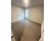 Bedroom featuring neutral carpet, a window with blinds, and a white door at 111 Woodside Ct, Temple, GA 30179