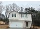 Charming two-story home with brick accents and a two-car garage in a wooded neighborhood at 111 Woodside Ct, Temple, GA 30179