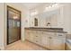 Luxurious bathroom featuring double sinks, granite counters, and a glass-enclosed shower at 130 Staddlebridge Ave, Canton, GA 30114