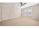 Neutral bedroom featuring plush carpet, fresh paint and large windows at 130 Staddlebridge Ave, Canton, GA 30114