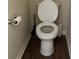 This bathroom features a standard height toilet, dark wood floors and neutral walls at 2190 Bridgewater Pass, Hampton, GA 30228