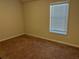 Cozy bedroom with carpeted floor and horizontal blinds on the window for natural light at 2190 Bridgewater Pass, Hampton, GA 30228