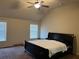 Spacious bedroom featuring large windows, carpet flooring and modern ceiling fan at 2190 Bridgewater Pass, Hampton, GA 30228