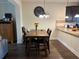 Charming dining area with a wooden table and seamless flow into the kitchen at 2190 Bridgewater Pass, Hampton, GA 30228