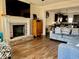 Inviting living room with a fireplace and seamless flow into the modern kitchen at 2190 Bridgewater Pass, Hampton, GA 30228