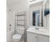 Bathroom featuring white cabinets, a shower/tub combination, and metallic storage at 4030 Brushy Creek Way, Suwanee, GA 30024