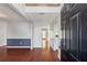 Welcoming foyer with hardwood floors, neutral paint, and view into other rooms at 4030 Brushy Creek Way, Suwanee, GA 30024