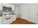 Kitchen featuring stainless steel appliances, and bright white cabinetry at 4030 Brushy Creek Way, Suwanee, GA 30024