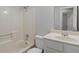 Bathroom with a shower-tub combo, white toilet, and a vanity with white sink and silver fixtures at 1400 Reddington Ln, Norcross, GA 30093