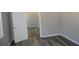 This bedroom features neutral walls and stylish dark gray wood flooring at 2568 Loghaven Nw Dr, Atlanta, GA 30318