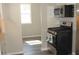 Modern kitchen with stainless steel gas range and gray hardwood floors at 2568 Loghaven Nw Dr, Atlanta, GA 30318