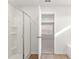 Bathroom featuring a glass shower, wooden flooring, and a view to the bedroom at 4167 Viola Pl, Atlanta, GA 30349