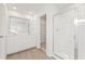 Bright bathroom with double sink vanity, glass-enclosed shower, and wooden floors at 4167 Viola Pl, Atlanta, GA 30349