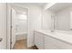 Modern bathroom with white cabinetry, quartz countertop, and a shower/tub combo at 4167 Viola Pl, Atlanta, GA 30349