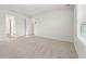 Spacious carpeted bedroom with views to the hall and bathroom at 4167 Viola Pl, Atlanta, GA 30349