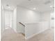 Upstairs hallway showing the staircase, carpet flooring and access to bedroom at 4167 Viola Pl, Atlanta, GA 30349