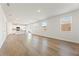 Large living room featuring wood floors, an open floor plan, and abundant natural light at 4167 Viola Pl, Atlanta, GA 30349