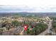 Aerial view of a residential area with tree-lined streets, showcasing home's location relative to nearby amenities at 5382 Whitaker Nw Trl, Acworth, GA 30101