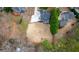 Expansive backyard with mature trees and a patio area, perfect for outdoor activities at 5382 Whitaker Nw Trl, Acworth, GA 30101