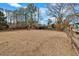The spacious backyard features a wooden fence, playset, and room to roam at 5382 Whitaker Nw Trl, Acworth, GA 30101