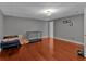 Unfurnished basement with hardwood flooring and a utility closet at 5382 Whitaker Nw Trl, Acworth, GA 30101