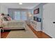 Cozy bedroom with hardwood floors, large windows, and ample natural light at 5382 Whitaker Nw Trl, Acworth, GA 30101