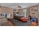 Spacious bedroom with hardwood floors, bed, fan, basketball decor, and study area at 5382 Whitaker Nw Trl, Acworth, GA 30101