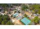 Aerial shot of the neighborhood pool, tennis courts, clubhouse, and playground, showcasing the community's amenities at 5382 Whitaker Nw Trl, Acworth, GA 30101