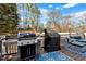 Outdoor deck featuring a Weber grill, Traeger grill and outdoor sofa and chairs with a blue area rug at 5382 Whitaker Nw Trl, Acworth, GA 30101