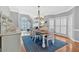 Bright dining room with natural light, hardwood floors, and a stylish chandelier at 5382 Whitaker Nw Trl, Acworth, GA 30101