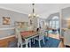 Cozy dining area featuring hardwood floors, area rug, and an open view to the living space at 5382 Whitaker Nw Trl, Acworth, GA 30101