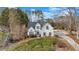 Elegant exterior view of the house showing the architecture and landscaping, including basketball hoop at 5382 Whitaker Nw Trl, Acworth, GA 30101