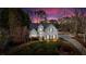Beautiful home with a classic facade, surrounded by trees and a long driveway with basketball hoop at 5382 Whitaker Nw Trl, Acworth, GA 30101