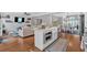Open floor plan featuring a kitchen island with stainless steel appliances and a living area at 5382 Whitaker Nw Trl, Acworth, GA 30101