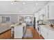 Open kitchen layout with an island, stainless appliances, and easy access to the dining area at 5382 Whitaker Nw Trl, Acworth, GA 30101