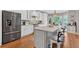 Spacious kitchen with a large island, stainless steel appliances, and custom cabinets at 5382 Whitaker Nw Trl, Acworth, GA 30101