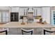 Bright kitchen with a center island, quartz countertops, and stainless steel appliances at 5382 Whitaker Nw Trl, Acworth, GA 30101