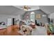 Cozy living area featuring hardwood floors, sofa, bean bag chair, and large window at 5382 Whitaker Nw Trl, Acworth, GA 30101