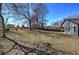 Expansive backyard showcasing ample green space, trees, and the rear facade of the home at 96 Wheelers Dr, Dallas, GA 30157