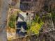 Overhead view of the home showcasing its mature trees and roof at 2212 Austin Lake Se Dr, Smyrna, GA 30082