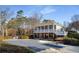 Two story building featuring a covered pool, covered porch, and outdoor seating at 2212 Austin Lake Se Dr, Smyrna, GA 30082