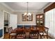 Formal dining room with hardwood floors, large window, and a china cabinet at 2212 Austin Lake Se Dr, Smyrna, GA 30082