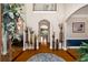 Elegant foyer with hardwood floors, arched doorways, and decorative vases lining the hallway at 2212 Austin Lake Se Dr, Smyrna, GA 30082