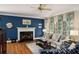 Cozy living room featuring a fireplace, plush seating, and natural light from the windows at 2212 Austin Lake Se Dr, Smyrna, GA 30082