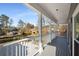 A covered porch view with decorative railings and neighborhood views at 2212 Austin Lake Se Dr, Smyrna, GA 30082