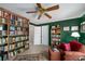 A charming study featuring bookshelves, a comfortable chair, and warm lighting, ideal for reading and relaxation at 2212 Austin Lake Se Dr, Smyrna, GA 30082